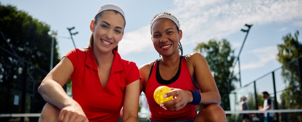 female pickleball players on court