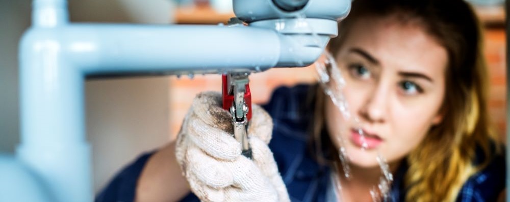 women working on sink